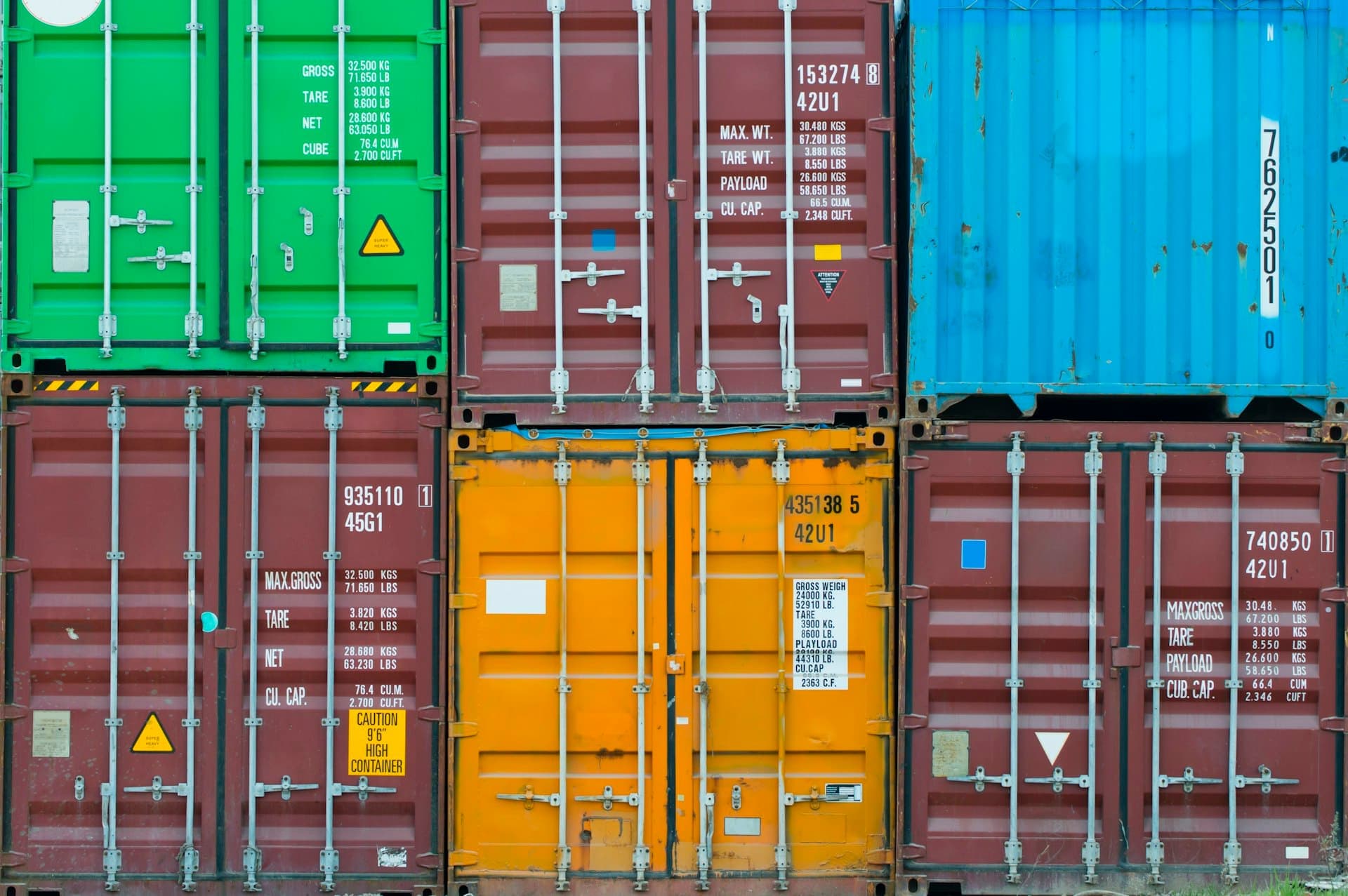 Close-up of sealed shipping container doors and locking bars